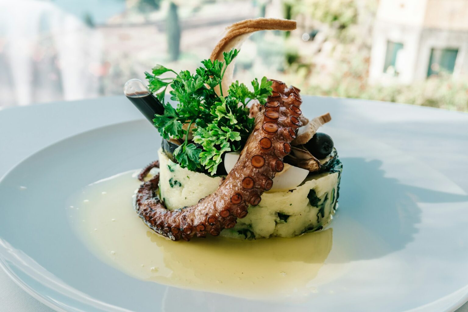 A white plate topped with food on top of a table