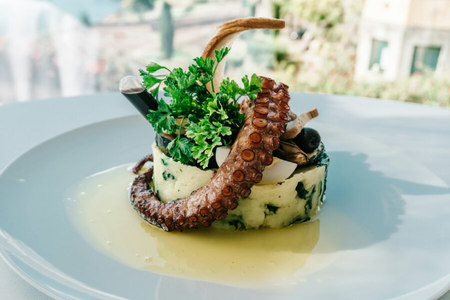A white plate topped with food on top of a table