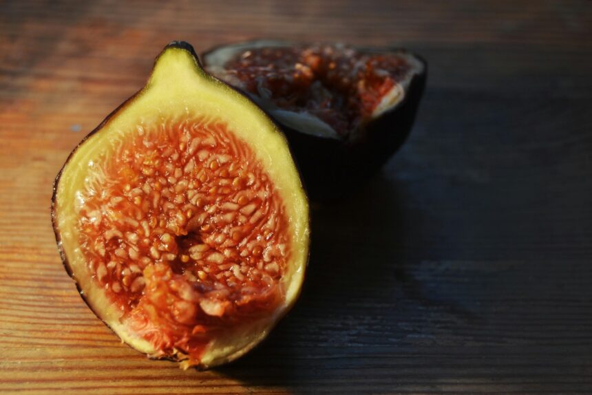 fig on brown wooden surface