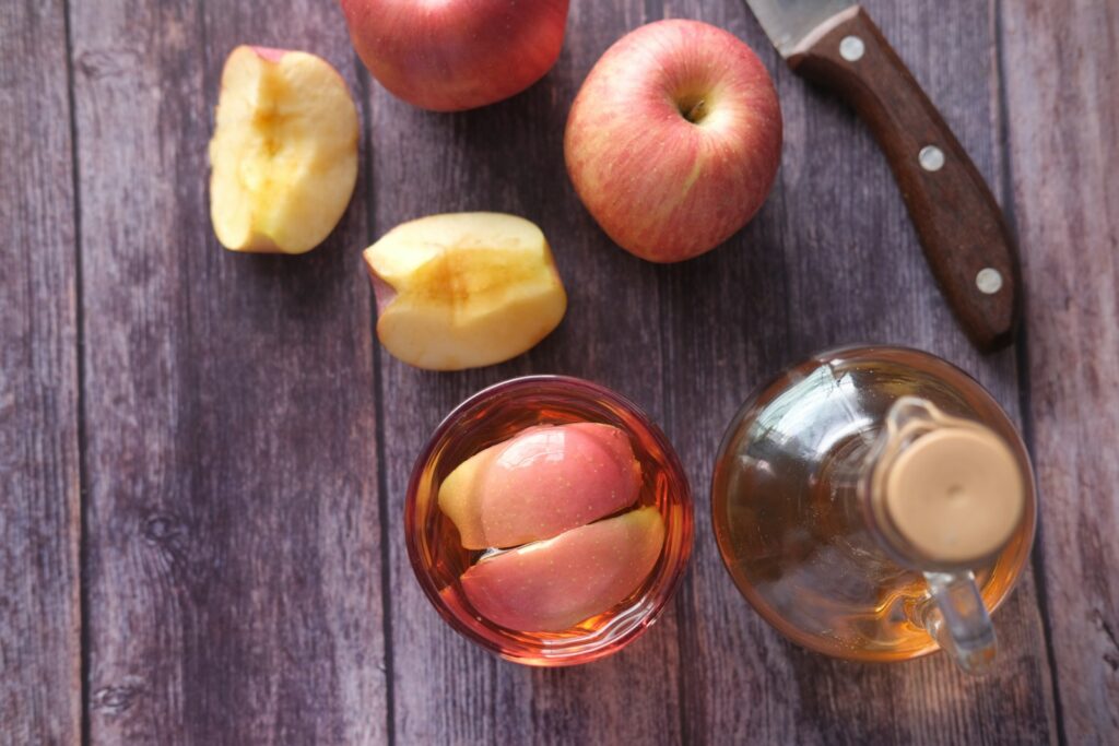 sliced apple beside black handled knife