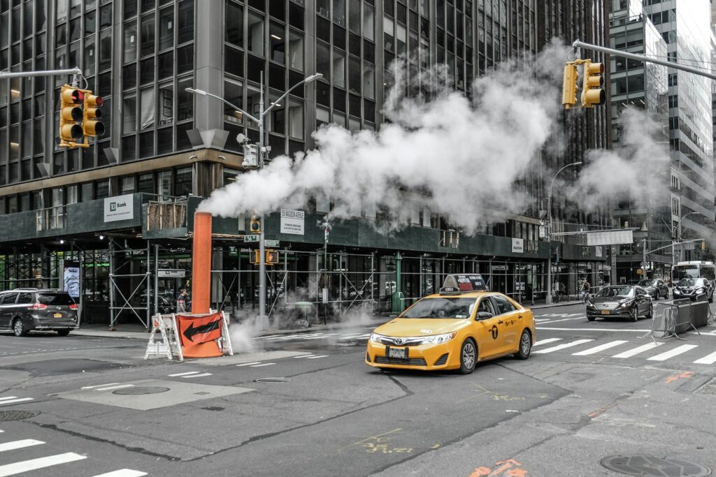 yellow car on road