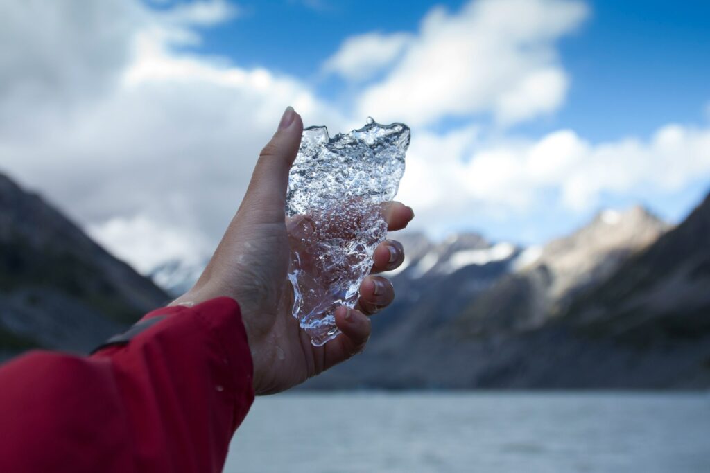 person holding clear ice