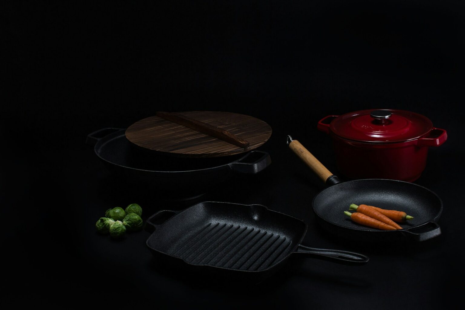 brown wooden round chopping board beside black frying pan