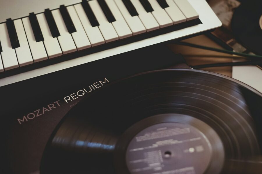 vinyl record near white electronic keyboard