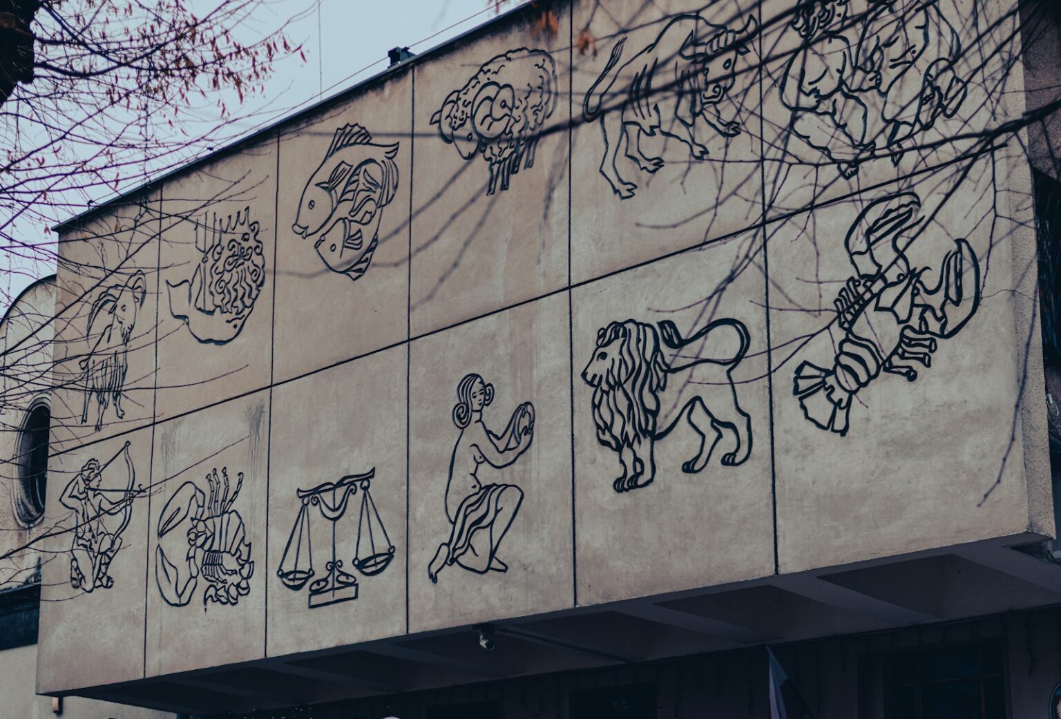 a building that has a bunch of drawings on it