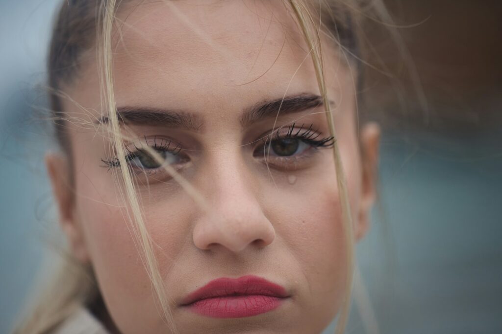 a close up of a person with long hair