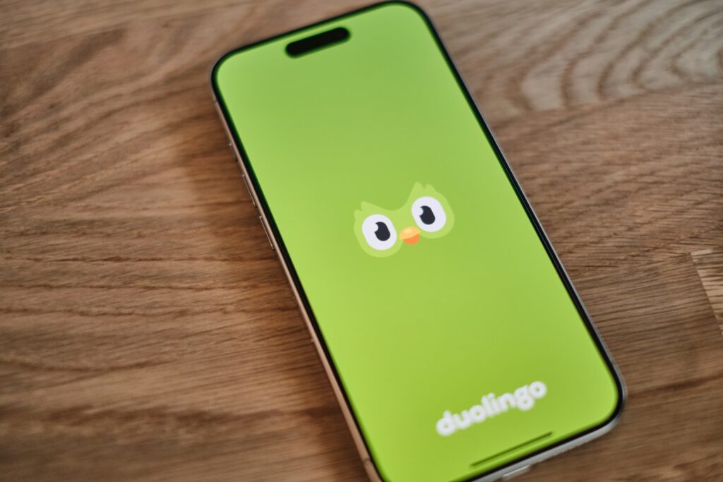 A green phone with a face drawn on it