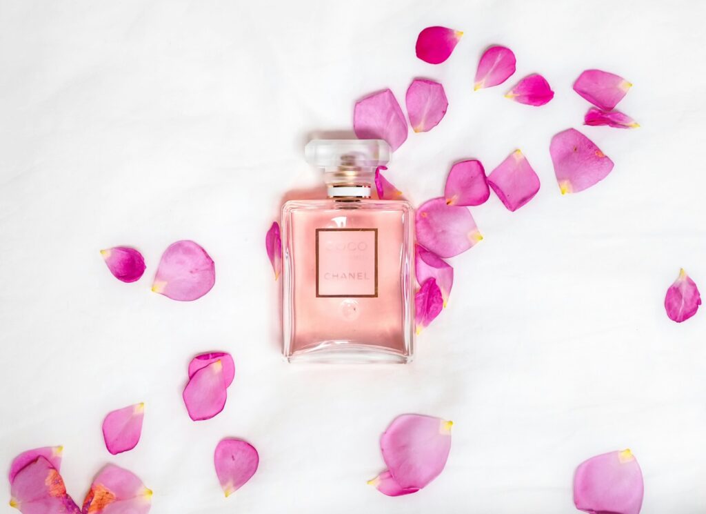 perfume bottle with pink petals